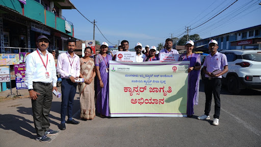 M.I.O. and Sanjeevini Cancer Seva Trust staff gather at the starting point of the Cancer Awareness Rally in Koppa