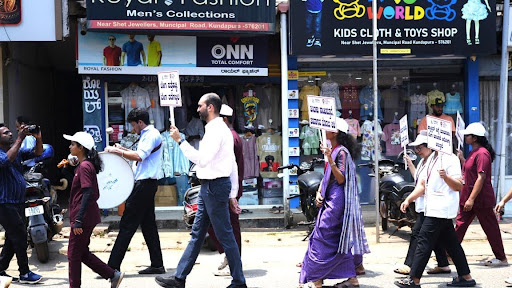 M.I.O staff, volunteers, and community members walk through the main roads of Kundapura, bringing the message of early cancer detection to every neighbourhood along the route.