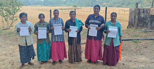 Paddy field workers at a threshing site participate in M.I.O.'s cancer awareness survey