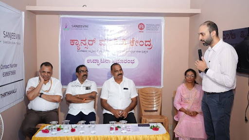 Dr. Venkataraman Kini, Secretary of Sanjeevini Cancer Seva Trust and Consultant Radiation Oncologist, addresses the gathering at the Kundapura Cancer Information Centre inauguration