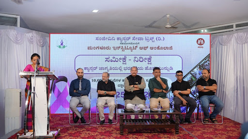 Jestalaxmi Boloor presents at the survey release event alongside the full panel of M.I.O. and Sanjeevini Cancer Seva Trust leadership