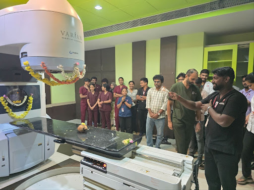 Staff members gives around the Linear Accelerator in a deeply emotional tribute